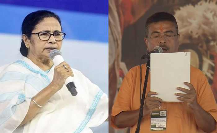 शुभेंदु अधिकारी मुख्यमंत्री पद की शपथ लेते हुए मंच पर खड़े हैं, साथ में भाजपा नेता और बड़ी संख्या में मौजूद लोग उत्साहपूर्वक तालियां बजा रहे हैं.